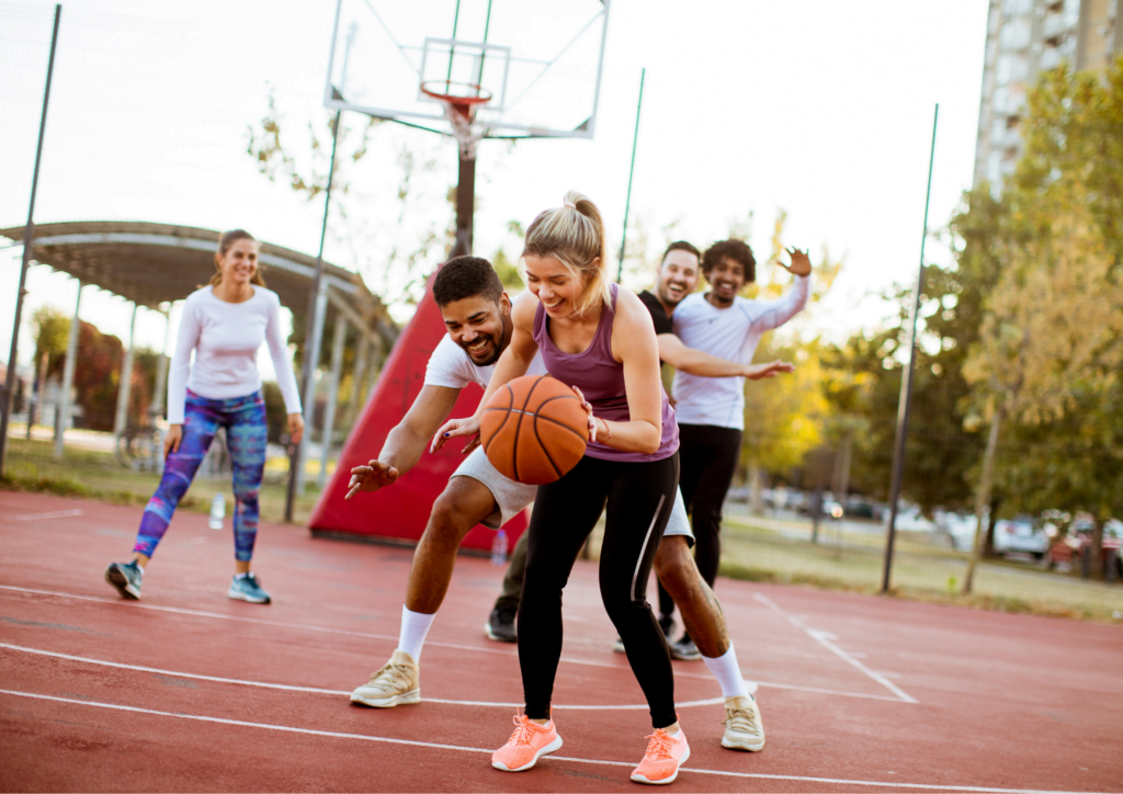 Image of a Women playing basketball representing youth organization that use Rhino Non-Profit Software
