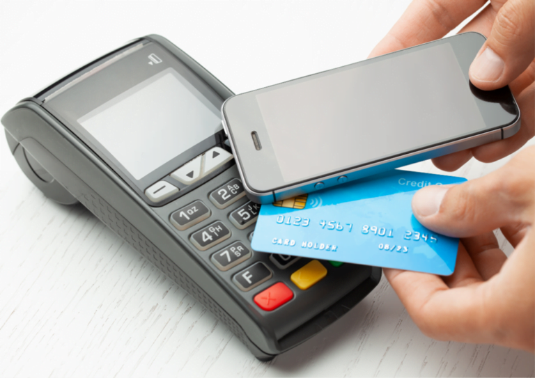 Image of a POS system with a customer paying for a transaction with a contactless card