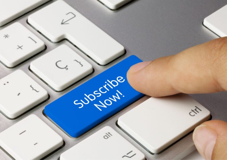 Image of a Keyboard with someone clicking on a subscribe now button representing subscription billing