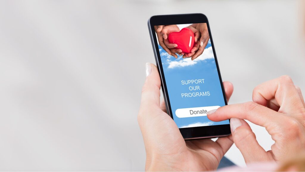 Image of a woman making a donation with the nonprofit software