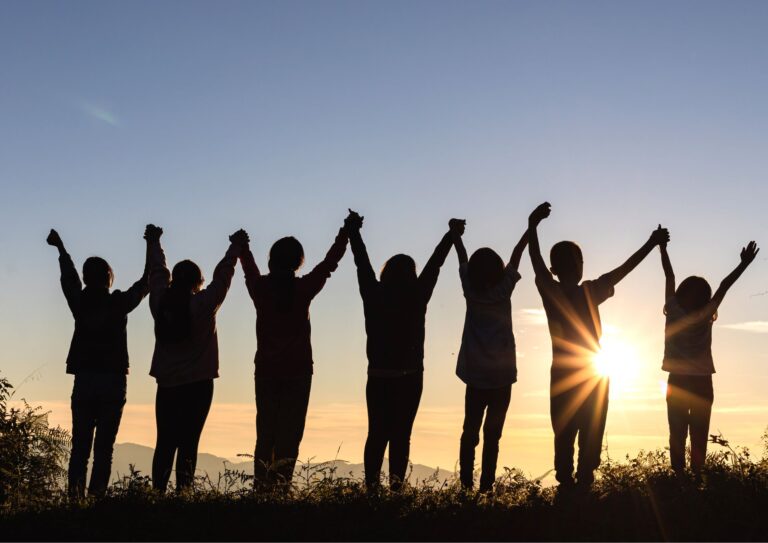 Image of a group of people admiring the sunset